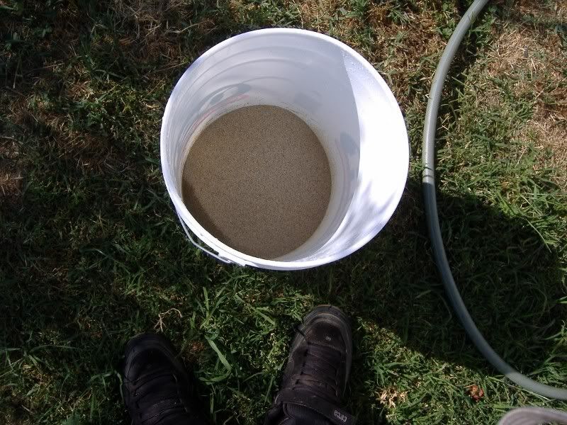 sand bucket with water hose