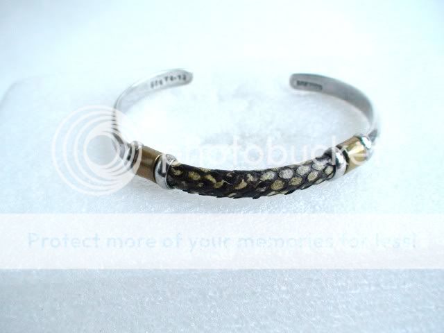   silver and brass cuff bracelet genuine snakeskin but i do not know
